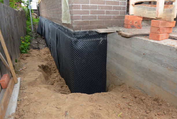 Happy homeowners after waterproofing job in Little River